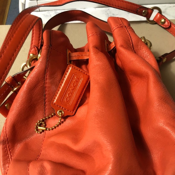 Coach Handbags - Small Coral Coach Drawstring Crossbody Bag